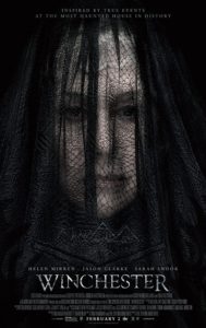 Film poster for Winchester. Image on poster is of Mrs. Winchester wearing a black mourning veil and staring straight ahead. 