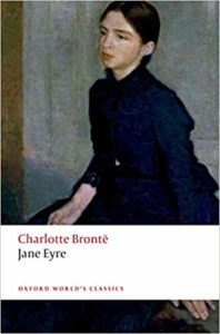 Book cover of Jane Eyre by Charlotte Bronte. It shows Jane sitting pensively against a plain background. 
