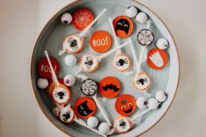 Round tin can filled with halloween candy. 