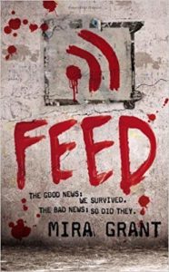 Book cover for Feed by Mira Grant. Image on it is of an Internet signal painted in blood (or red paint) on a concrete wall. 