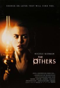 Film poster for The Others. Image shows Nicole Kidman holding a glass lamp and staring off into the corner with a fearful expression on her face. 