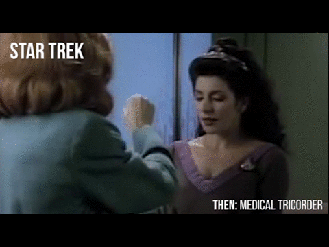 Beverly Crusher from Star Trek: The Next Generation scanning Counsellor Troi with a medical tricorder.  