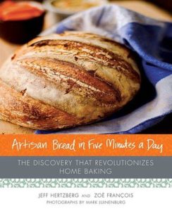 Artisan Bread in Five Minutes a Day: The Discovery That Revolutionizes Home Baking byJeff Hertzberg and  Zoë François book cover. Image on cover is of a freshly baked loaf of bread. 