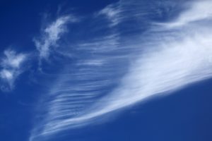 Clouds being blown by a breeze. 