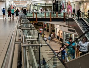 People walking around in a brightly lit mall