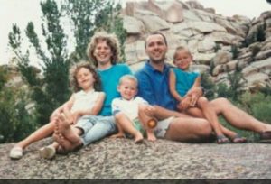 A photo of Lydia Schoch, her parents, and two younger brothers at Vedauwoo National Park in the 1990s. 