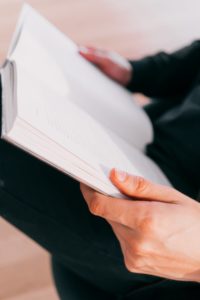 Person reading a book.