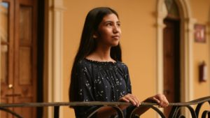 Girl holding handrail