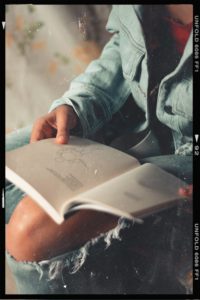 Person reading a book. 
