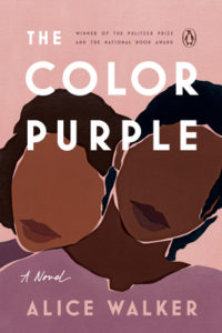 The Color Purple by Alice Walker book cover. Image on cover is of a drawing of two african american women. Their lips are drawn but not their eyes , noses or eyebrows