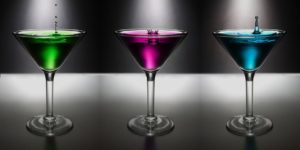 Three martinis. One green, one purple, and one blue. 