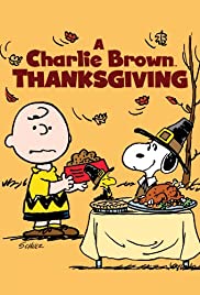 Poster for A Charlie Brown Thanksgiving. Image shows Charlie Brown and Snoopy standing next to table with a turkey and pie on it. 