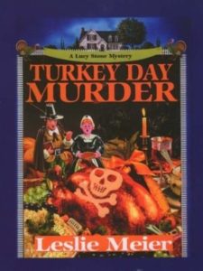 Turkey Day Murder (A Lucy Stone Mystery, #7) by Leslie Meier book cover. Image on cover is of two pilgrims looking shocked by a skull and crossbones that have been carved into a turkey. 