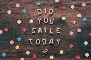 Wooden sign with polka dots and the words "did you smile today?" written on it