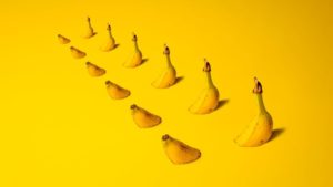 Bananas that are submerged in a bright yellow landscape.