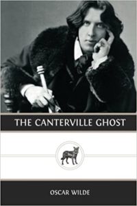 The Canterville Ghost by Oscar Wilde book cover. Image on cover is a black-and-white photo of Mr. Wilde holding a cane as he bends over and gently touches his face. 