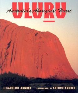 Uluru- Australia's Aboriginal Heart by Caroline Arnold book cover. Image on cover shows Mount Uluru in all of it's red, dusty glory. 