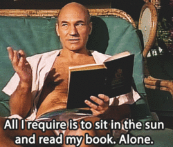 Captain Picard sitting in a lounge chair in the sun. He says "All I require is the sit in the sune and read my book. Alone." 