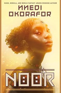 Noor by Nnedi Okorafor book cover. Image on cover shows african woman holding her head up high. 