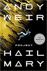 Project Hail Mary by Andy Weir book cover. Image on cover shows an astronaut floating through space while tethered to their ship. There is a large sun or planet in the background. 