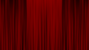 Red, closed cinema curtains.