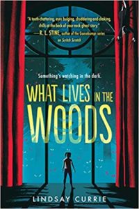 What Lives in the Woods by Lindsay Currie book cover. Image on cover is a painting of a kid standing in front of a two-story picture window at night. There are yelllow-eyed creatures standing outside leering at her. 