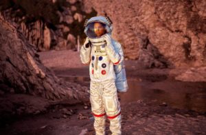 An astronaut standing on Mars. 