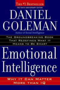 Emotional Intelligence: Why It Can Matter More Than IQ by Daniel Goleman book cover. There is no image on this cover. It’s just blue and red background. 