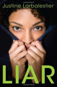 Liar by Justine Larbalestier book cover. Image on cover shows a young black woman hiding her face in her hoodie. 