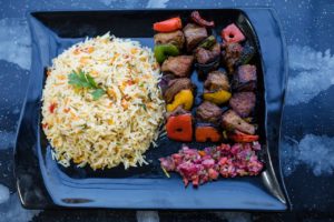 Shish Kabob, rice, and other East African food. 