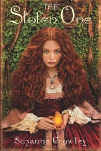 The Stolen One by Suzanne Crowley Book cover. Image on cover shows a woman with curly red hair sitting at a table and glaring at the reader. 