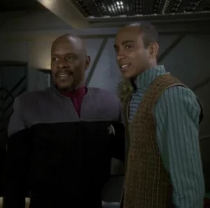 Benjamin and Jake Sisko from Star Trek: Deep Space Nine. They are smiling and posing together in their Star Trek uniforms. 