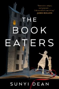 The Book Eaters by Sunyi Dean book cover. Image on cover shows cutouts of a mother and child from the pages of a book. These silhouettes are walking up to a building made from the page of a print book and looking at a lit window in it as the mom points at it. 