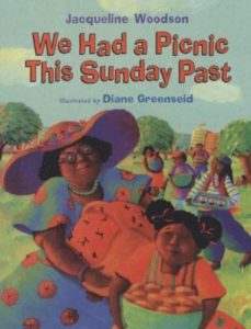 We Had a Picnic This Sunday Past by Jacqueline Woodson book cover. Image on cover shows a drawing of a grandmother and granddaughter carrying a picnic basket in a park. 