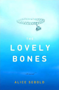 he Lovely Bones by Alice Sebold book cover. Image on cover shows a charm bracelet with only one charm on it. The charm is in the shape of a house. 