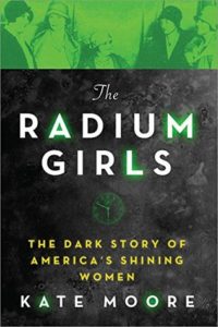 The Radium Girls: The Dark Story of America's Shining Women by Kate Moore Book cover. Image on cover shows four young flapper women talking during a photo. There is a green hue overlaid them to symbolize the radium that poisoned them. 