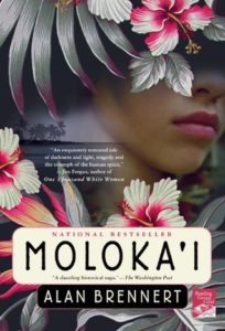 Moloka'i (Moloka'i, #1) by Alan Brennert book cover. Image on cover shows a drawing of a Hawaiian woman’s face covered partially by flowers. 