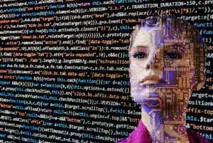 The first layer on this picture is a computer screen where dozens of lines of code has been written. This code is overlaid on the face of a robot that looks like a caucasian woman with very short light brown hair. She is staring blankly ahead as if to wait for instructions from the viewer…or perhaps she is reading the code. 