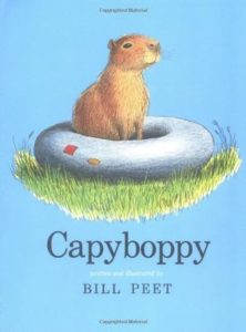 Book cover for Capyboppy by Bill Peet. Image on cover shows a drawing of a capybara sitting on an inner tube on a patch of grass.