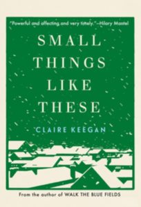 Book cover for Small Things Like These by Claire Keegan. Image on cover shows a drawing of a little town that is getting blanketed in a heavy snowstorm. The background of the cover is green and the town and snow can be seen because they are all white. 