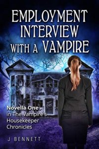 Book cover for Employment Interview With a Vampire by J Bennett. Image on cover shows a young white woman with dark blond hair that’s tied behind her head in a ponytail. She’s standing in front of a decrepit mansion on an overcast evening and about to walk into the home. She’s wearing an all black outfit. 