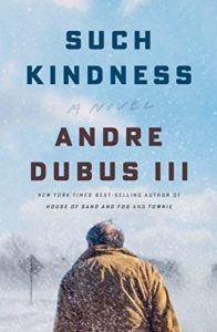 Book cover for Such Kindness by Andre Dubus III. Image on cover shows a photo of a bald old man walking gingerly down an otherwise deserted road on a partly cloudy winter day. 