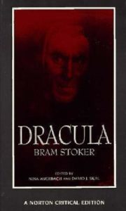 Book cover for Dracula by Bram Stoker. Image on cover is mostly in shadow, but in the top third you can see the frightening red face of a vampiric monster leering at you from the shadows. 