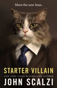Book cover for Starter Villain by John Scalzi. Image on cover shows a housecat who is sitting up and posing for a portrait. The cat is wearing a suit and tie. They have light brown fur with black streaks in it and a darling little white nose and mouth. 