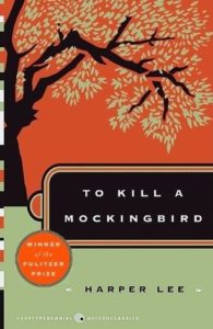 Book cover for To Kill a Mockingbird by Harper Lee. Image on cover is a drawing of a maple tree whose leaves have begun to turn colours in the autumn. The tree is growing on a hill and the sky behind it is orange. 
