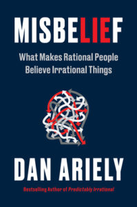 Book cover for Misbelief: What Makes Rational People Believe Irrational Things by Dan Ariely. Image on cover shows a drawing of a profile of a human head. There are grey, red, and white lines squiggled up everywhere inside of the head. At the end of each line is a little arrow the same colour as the rest of the line. 