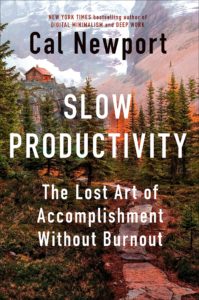 Book cover for Slow Productivity: The Lost Art of Accomplishment Without Burnout by Cal Newport. Image on cover shows a painting of a pine forest with a river running through it. The land has been tinted pink by the setting sun filtering through the puffy white clouds in the sky. 