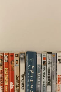 A closeup photo of about a dozen DVD cases, including cases for Friends, Pulp Fiction, Django, and several other films that don’t have English titles. 
