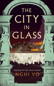 Book cover for The City in Glass by Nghi Vo. Image on cover is a drawing of a city on fire just after dusk. We are looking at the flames from far away while standing under two carved stone pillars that are still connected by a piece of stone placed on top of them. There are female figures carved into the pillars. They look a little like Greek goddesses. 