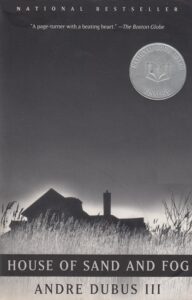 Book cover for House of Sand and Fog by Andre Dubus III. Image on cover is a black and white sketch of an old farmhouse at dusk. Fog is enveloping the land and blurring the house as well as the dry grasses growing tall beside it. This appears to be set in late autumn. 